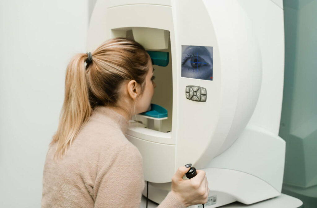 A teenage girl undergoing a visual field test to identify blind spots or other abnormalities in her peripheral vision